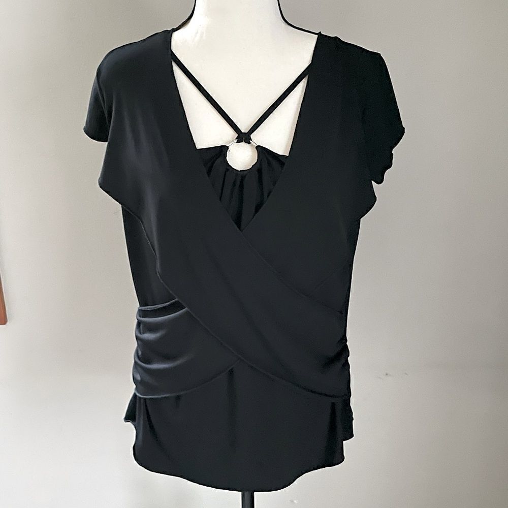 Discreet Black Top. Fits Like a Medium to Large.
